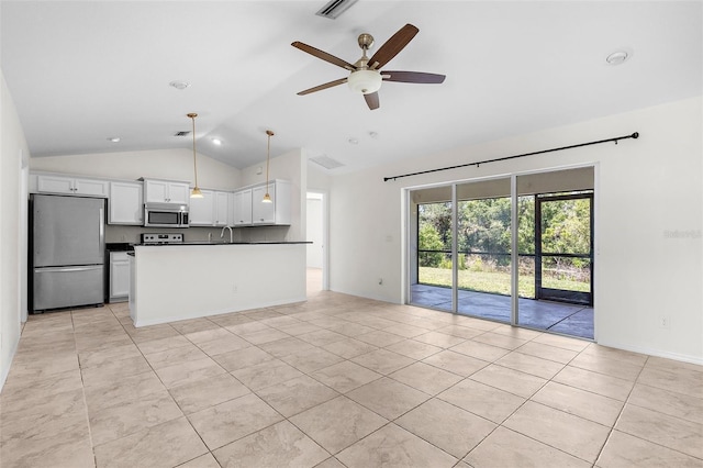 2575 Johannesberg Rd, North Port, FL 34288 - kitchen with appliances with stainless steel finishes, lofted ceiling, open floor plan, white cabinetry, and a ceiling fan