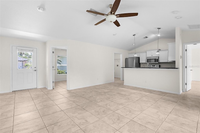2575 Johannesberg Rd, North Port, FL 34288 - unfurnished living room featuring a ceiling fan, lofted ceiling, and light tile patterned floors
