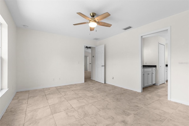 2575 Johannesberg Rd, North Port, FL 34288 - empty room featuring a ceiling fan and baseboards