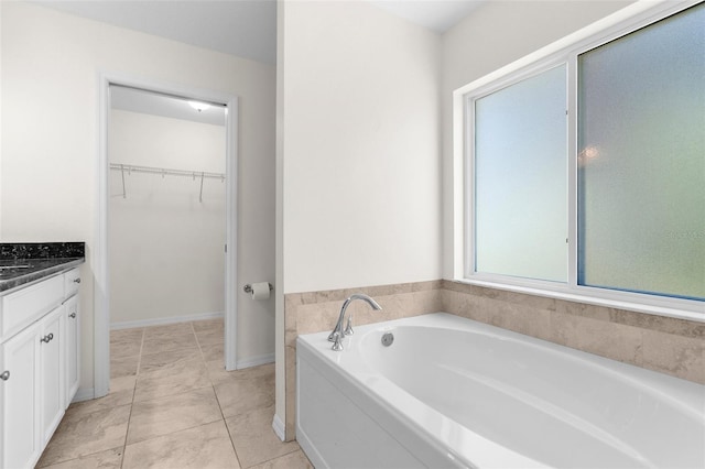 2575 Johannesberg Rd, North Port, FL 34288 - full bathroom with a spacious closet, vanity, and a garden tub