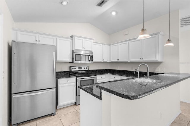 2575 Johannesberg Rd, North Port, FL 34288 - kitchen featuring stainless steel appliances, vaulted ceiling, white cabinets, dark stone counters, and light tile patterned floors