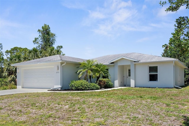 2575 Johannesberg Rd, North Port, FL 34288 - single story home with a garage, driveway, a front lawn, and stucco siding