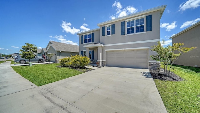 12728 Lateral Root Dr, Sarasota, FL 34238 - traditional-style house featuring concrete driveway, stucco siding, an attached garage, and a front lawn