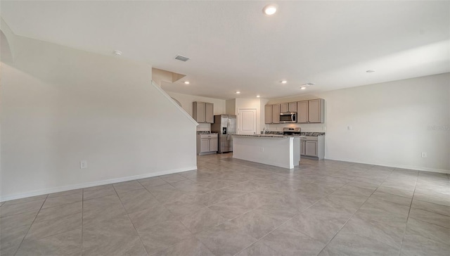 12728 Lateral Root Dr, Sarasota, FL 34238 - unfurnished living room with recessed lighting, baseboards, and a sink