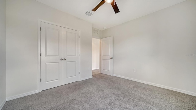 12728 Lateral Root Dr, Sarasota, FL 34238 - unfurnished bedroom with carpet floors, a closet, baseboards, and ceiling fan