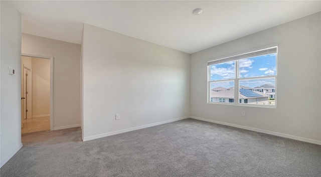 12728 Lateral Root Dr, Sarasota, FL 34238 - carpeted empty room with baseboards