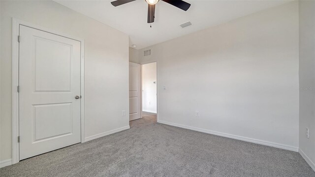 12728 Lateral Root Dr, Sarasota, FL 34238 - unfurnished bedroom with carpet, baseboards, and a ceiling fan