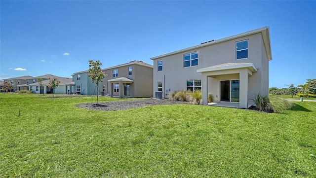 12728 Lateral Root Dr, Sarasota, FL 34238 - back of property featuring stucco siding, a yard, a residential view, and central air condition unit