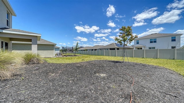 12728 Lateral Root Dr, Sarasota, FL 34238 - view of yard featuring a trampoline and a residential view