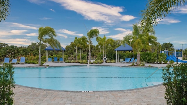 12728 Lateral Root Dr, Sarasota, FL 34238 - community pool featuring a patio area