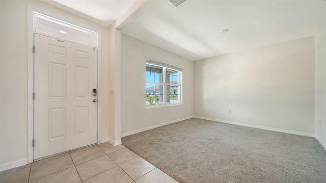 12732 Lateral Root Dr, Sarasota, FL 34238 - entrance foyer featuring light carpet, baseboards, and light tile patterned floors