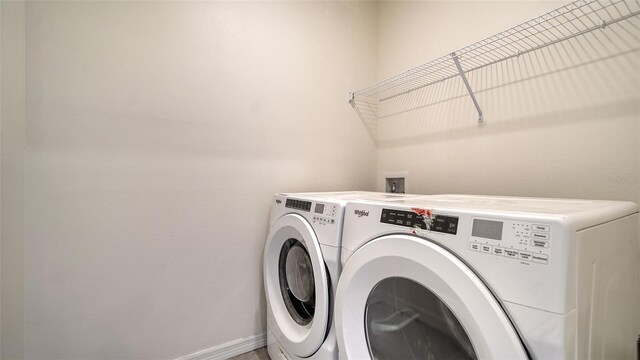 12732 Lateral Root Dr, Sarasota, FL 34238 - laundry room featuring independent washer and dryer