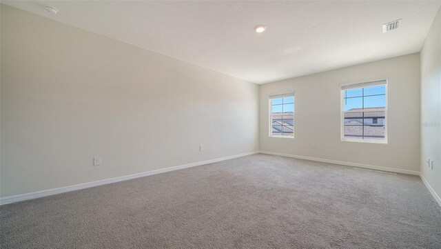 12732 Lateral Root Dr, Sarasota, FL 34238 - carpeted spare room with baseboards, a smoke detector, and recessed lighting