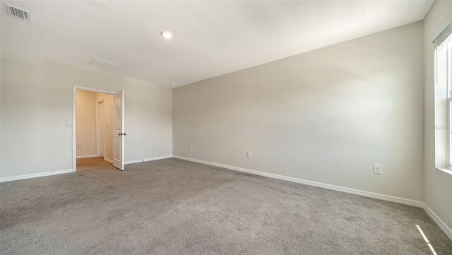 12732 Lateral Root Dr, Sarasota, FL 34238 - carpeted empty room with baseboards