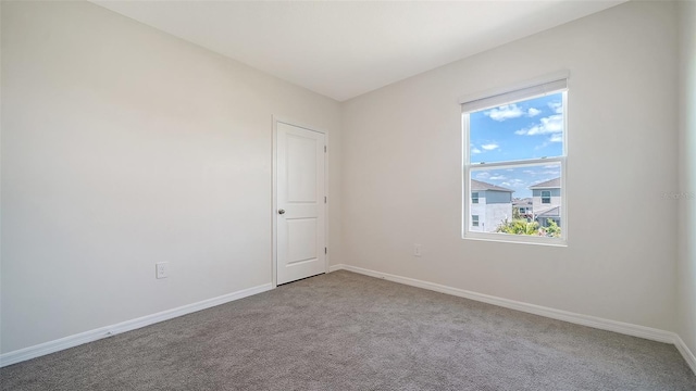 12732 Lateral Root Dr, Sarasota, FL 34238 - carpeted spare room featuring baseboards