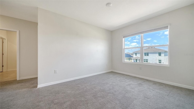 12732 Lateral Root Dr, Sarasota, FL 34238 - carpeted spare room with baseboards