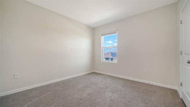 12732 Lateral Root Dr, Sarasota, FL 34238 - carpeted spare room with baseboards