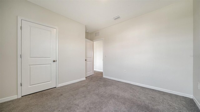 12732 Lateral Root Dr, Sarasota, FL 34238 - unfurnished bedroom with carpet floors and baseboards