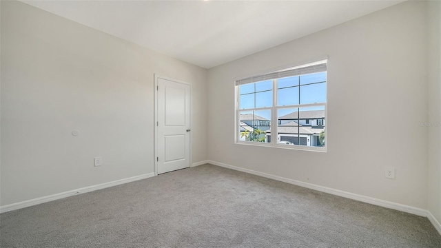 12732 Lateral Root Dr, Sarasota, FL 34238 - carpeted empty room featuring baseboards