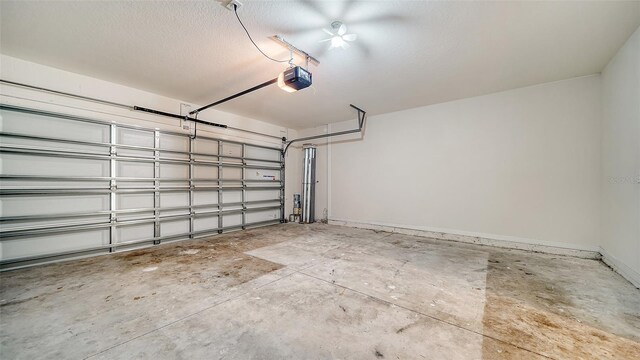 12732 Lateral Root Dr, Sarasota, FL 34238 - garage featuring a garage door opener and baseboards