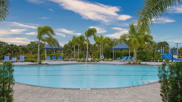 12732 Lateral Root Dr, Sarasota, FL 34238 - community pool featuring a patio area