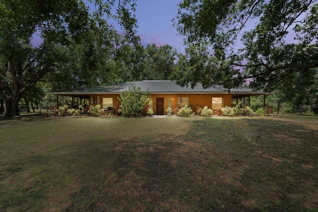 13719 Seminole Trl, Wimauma, FL 33598 - ranch-style home featuring a yard, an attached carport, and metal roof