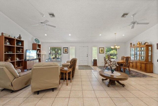 13719 Seminole Trl, Wimauma, FL 33598 - living room with a ceiling fan, vaulted ceiling, a chandelier, light tile patterned floors, and recessed lighting
