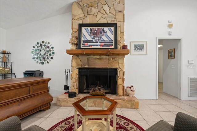 13719 Seminole Trl, Wimauma, FL 33598 - living area with tile patterned flooring, a stone fireplace, and baseboards