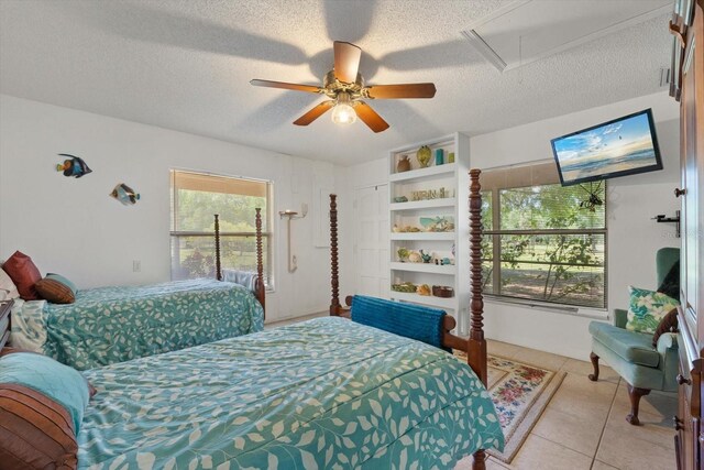 13719 Seminole Trl, Wimauma, FL 33598 - bedroom with attic access, a textured ceiling, light tile patterned floors, and ceiling fan