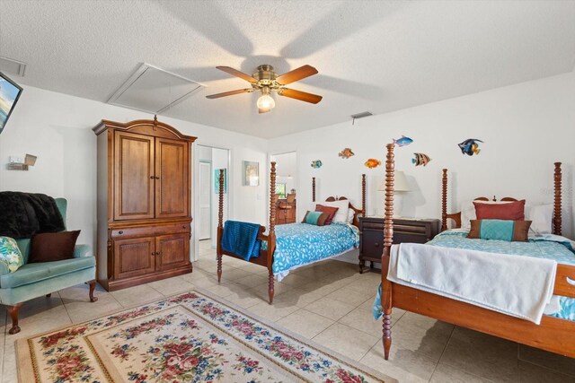 13719 Seminole Trl, Wimauma, FL 33598 - bedroom with attic access, ceiling fan, a textured ceiling, and light tile patterned floors