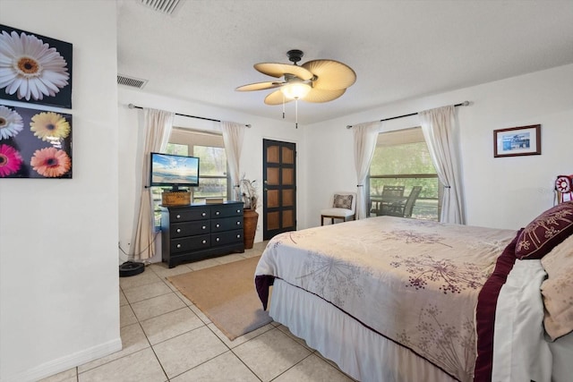 13719 Seminole Trl, Wimauma, FL 33598 - tiled bedroom featuring baseboards and ceiling fan