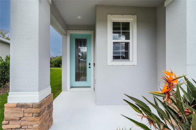 10962 High Noon Trl, Parrish, FL 34219 - view of exterior entry with stucco siding