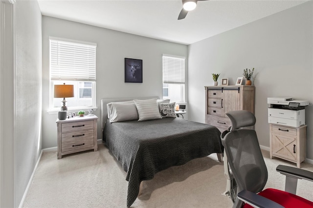 10962 High Noon Trl, Parrish, FL 34219 - bedroom featuring light carpet, baseboards, multiple windows, and ceiling fan