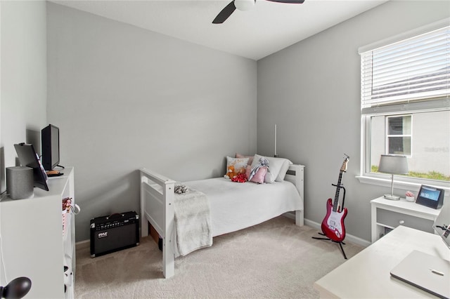 10962 High Noon Trl, Parrish, FL 34219 - bedroom with carpet floors, baseboards, and ceiling fan