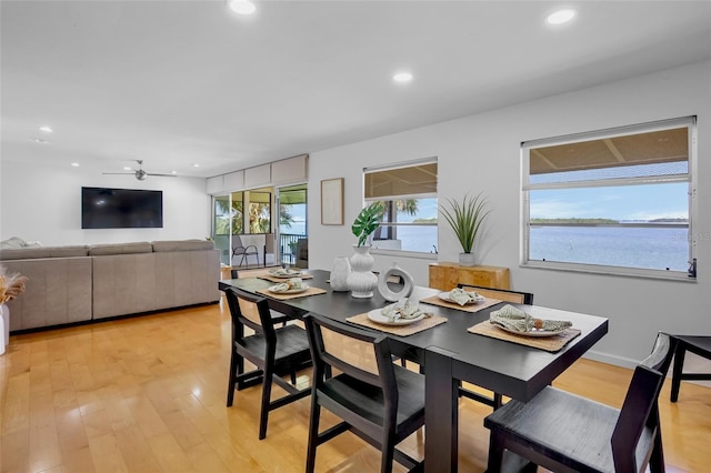 dining space with recessed lighting and light wood finished floors