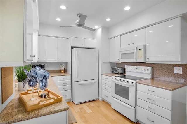 kitchen with white appliances, white cabinets, light wood-style flooring, ceiling fan, and recessed lighting