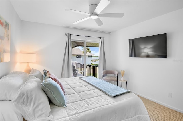 carpeted bedroom with access to exterior, baseboards, and a ceiling fan