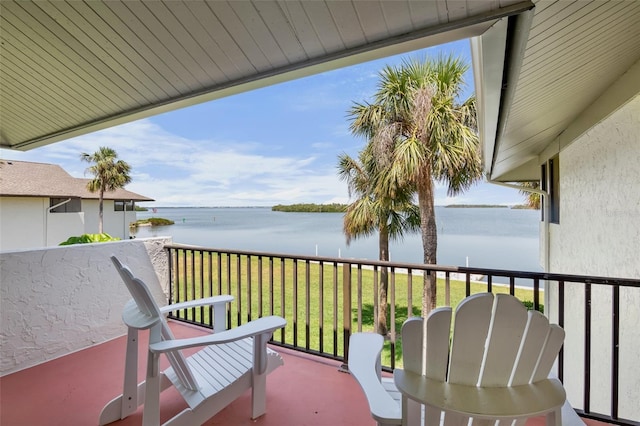 balcony featuring a water view