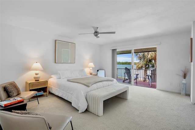 carpeted bedroom featuring access to outside and a ceiling fan