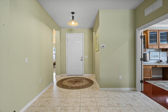 4402 Natures Reach Ter, Parrish, FL 34219 - foyer entrance with light tile patterned floors and baseboards