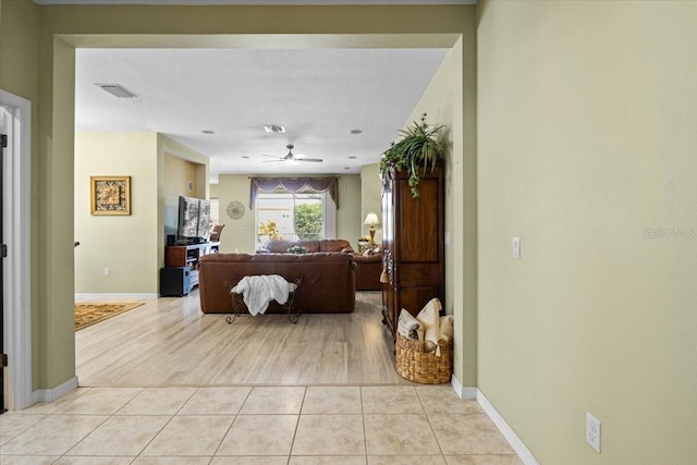 4402 Natures Reach Ter, Parrish, FL 34219 - living area featuring ceiling fan, baseboards, and light tile patterned floors