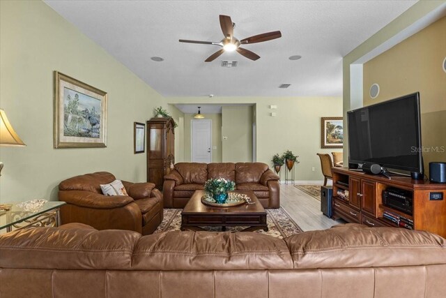 4402 Natures Reach Ter, Parrish, FL 34219 - living area with ceiling fan, wood finished floors, and baseboards