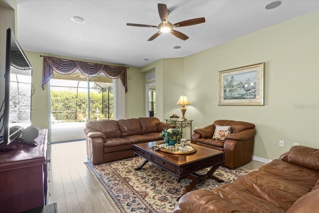 4402 Natures Reach Ter, Parrish, FL 34219 - living room featuring ceiling fan and light wood-type flooring
