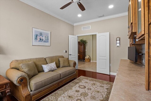 4402 Natures Reach Ter, Parrish, FL 34219 - living area featuring ceiling fan, ornamental molding, wood finished floors, baseboards, and recessed lighting