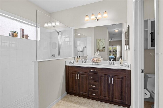 4402 Natures Reach Ter, Parrish, FL 34219 - full bathroom with walk in shower, double vanity, toilet, and tile patterned flooring