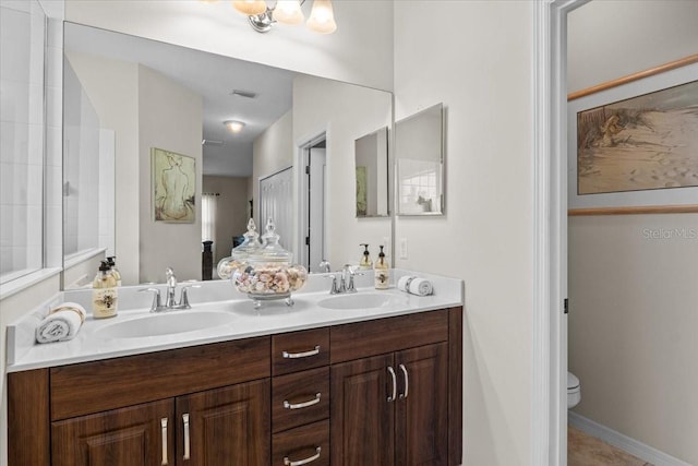4402 Natures Reach Ter, Parrish, FL 34219 - bathroom with double vanity and toilet