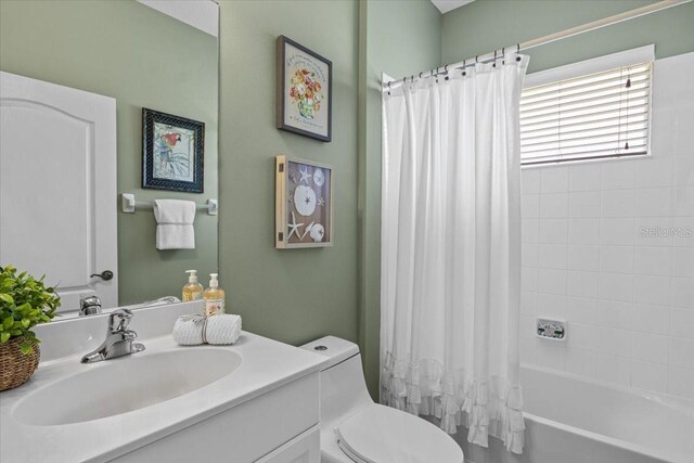 4402 Natures Reach Ter, Parrish, FL 34219 - bathroom with vanity, toilet, and shower / bathtub combination with curtain