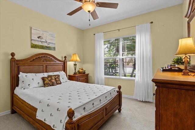 4402 Natures Reach Ter, Parrish, FL 34219 - bedroom featuring light carpet, baseboards, and a ceiling fan