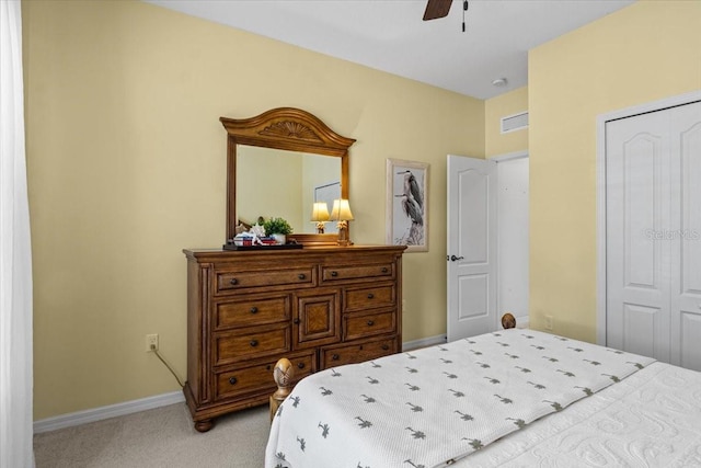 4402 Natures Reach Ter, Parrish, FL 34219 - bedroom featuring light colored carpet, baseboards, a closet, and a ceiling fan