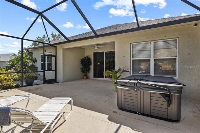 4402 Natures Reach Ter, Parrish, FL 34219 - view of patio featuring a hot tub, a ceiling fan, and glass enclosure